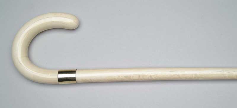 Appraisal: OUTSTANDING CARVED IVORY CANE Hooked handle has marked K yellow