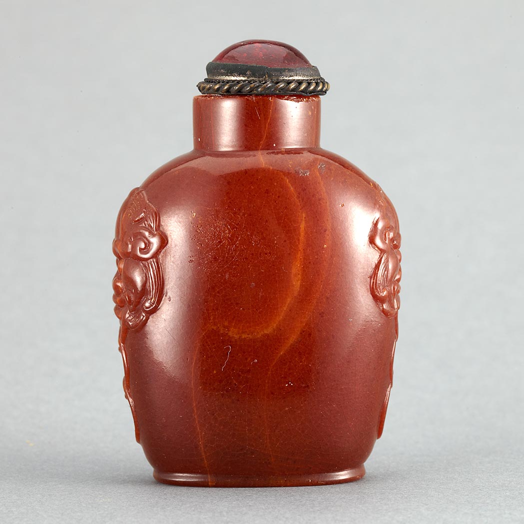 Appraisal: Chinese Amber Snuff Bottle th th Century Raised on an