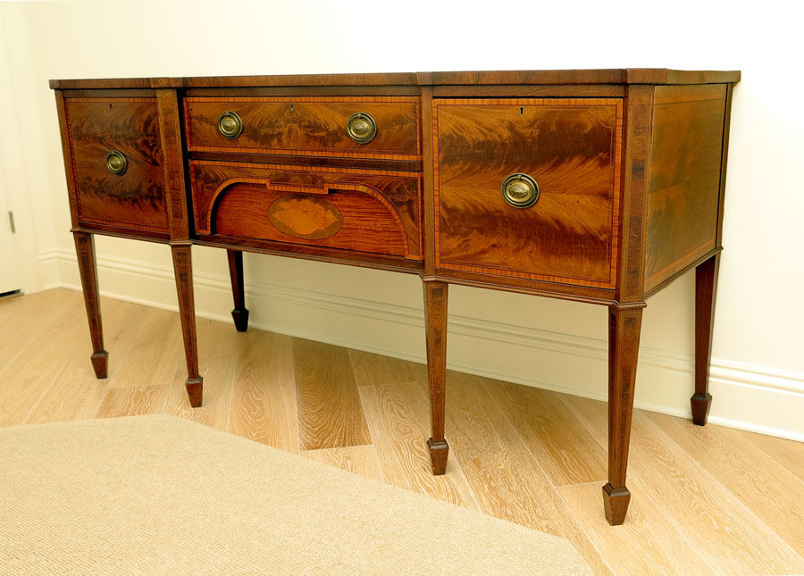 Appraisal: HEPPLEWHITE STYLE INLAID WALNUT SIDEBOARD Shaped top with string inlay