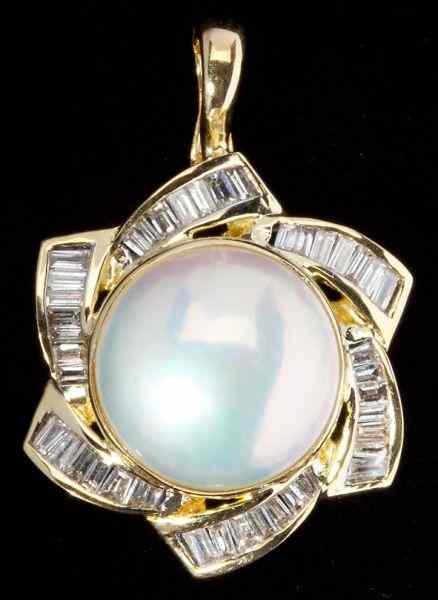 Appraisal: Diamond and Mabe Pearl Pendant Enhancercentering on one Mabe pearl