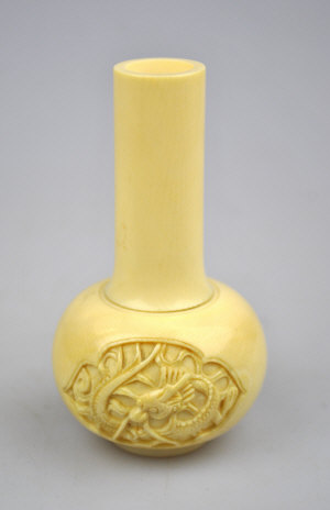 Appraisal: A Chinese carved ivory small ovoid vase with a tall