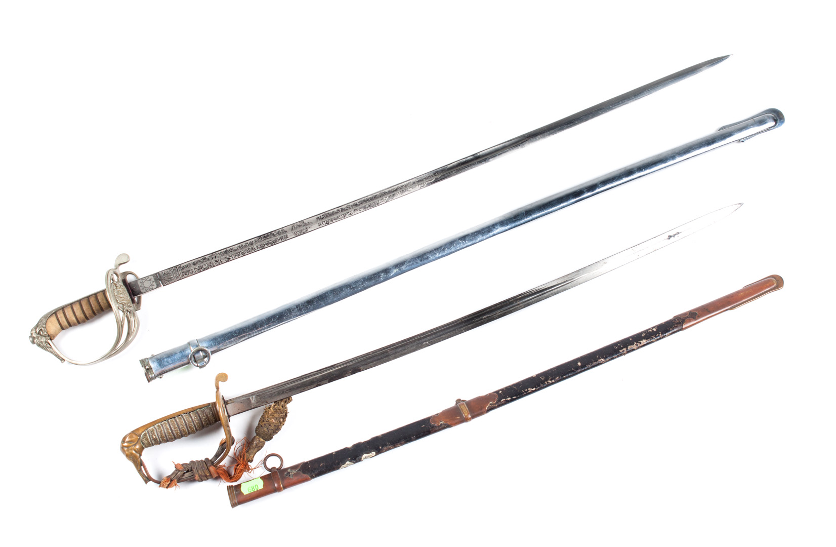 Appraisal: Two Thai Royal Army western-pattern swords each with elephant-head pommel