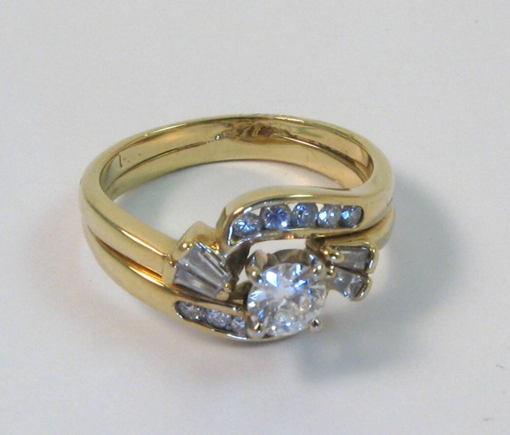 Appraisal: DIAMOND AND FOURTEEN KARAT GOLD RING set with a brilliant-cut