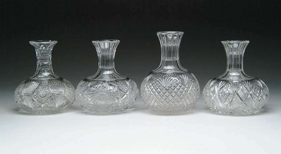 Appraisal: FOUR CUT GLASS WATER CARAFES Strawberry diamond and fan pattern