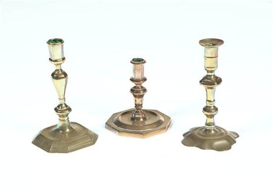 Appraisal: THREE BRASS CANDLESTICKS European th-early th century All have seamed