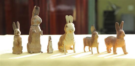 Appraisal: FIVE PAPER MACHE RABBIT CANDY CONTAINERS Three seated one standing