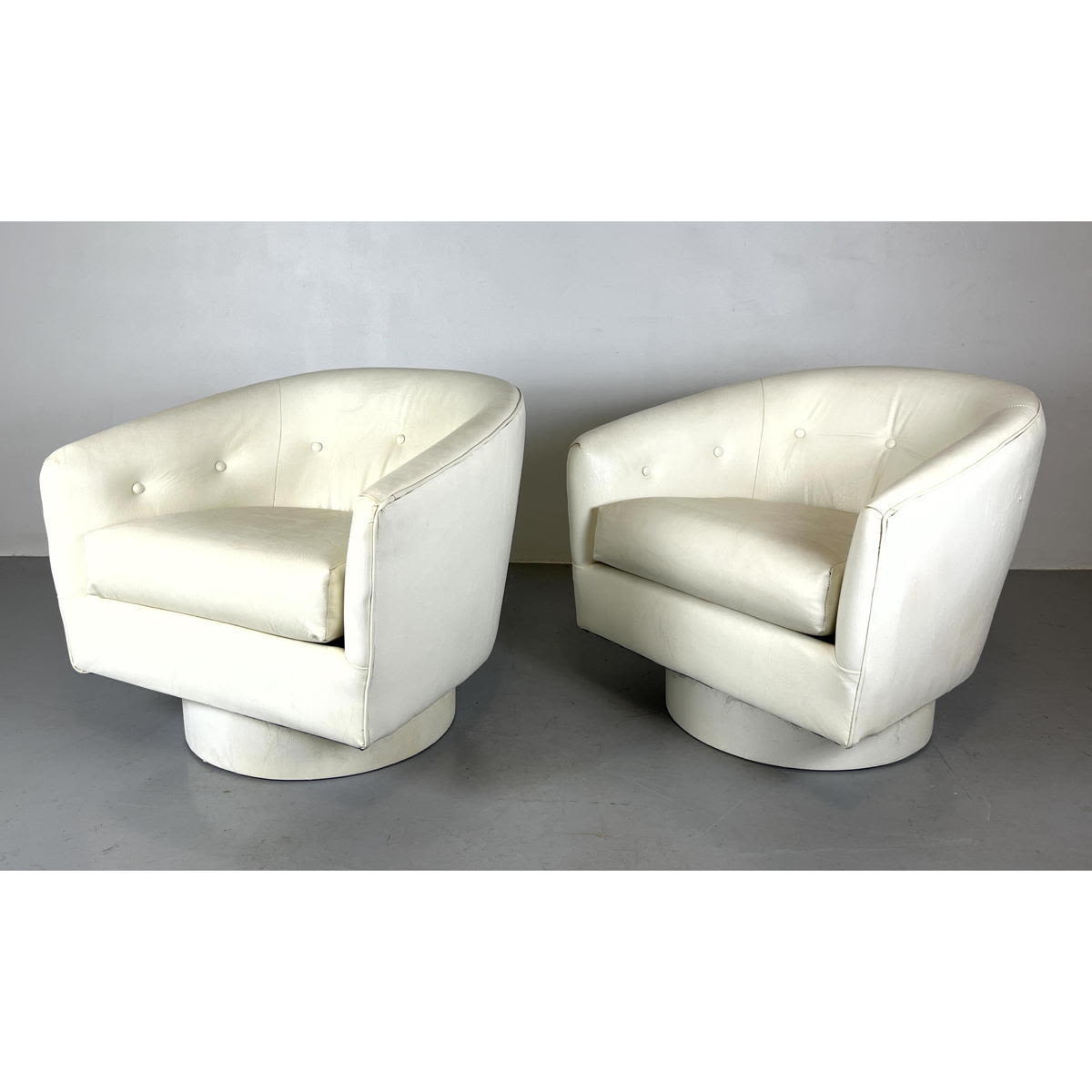 Appraisal: Pr Barrel Back Swivel Lounge Chairs White Vinyl Upholstery Baughman