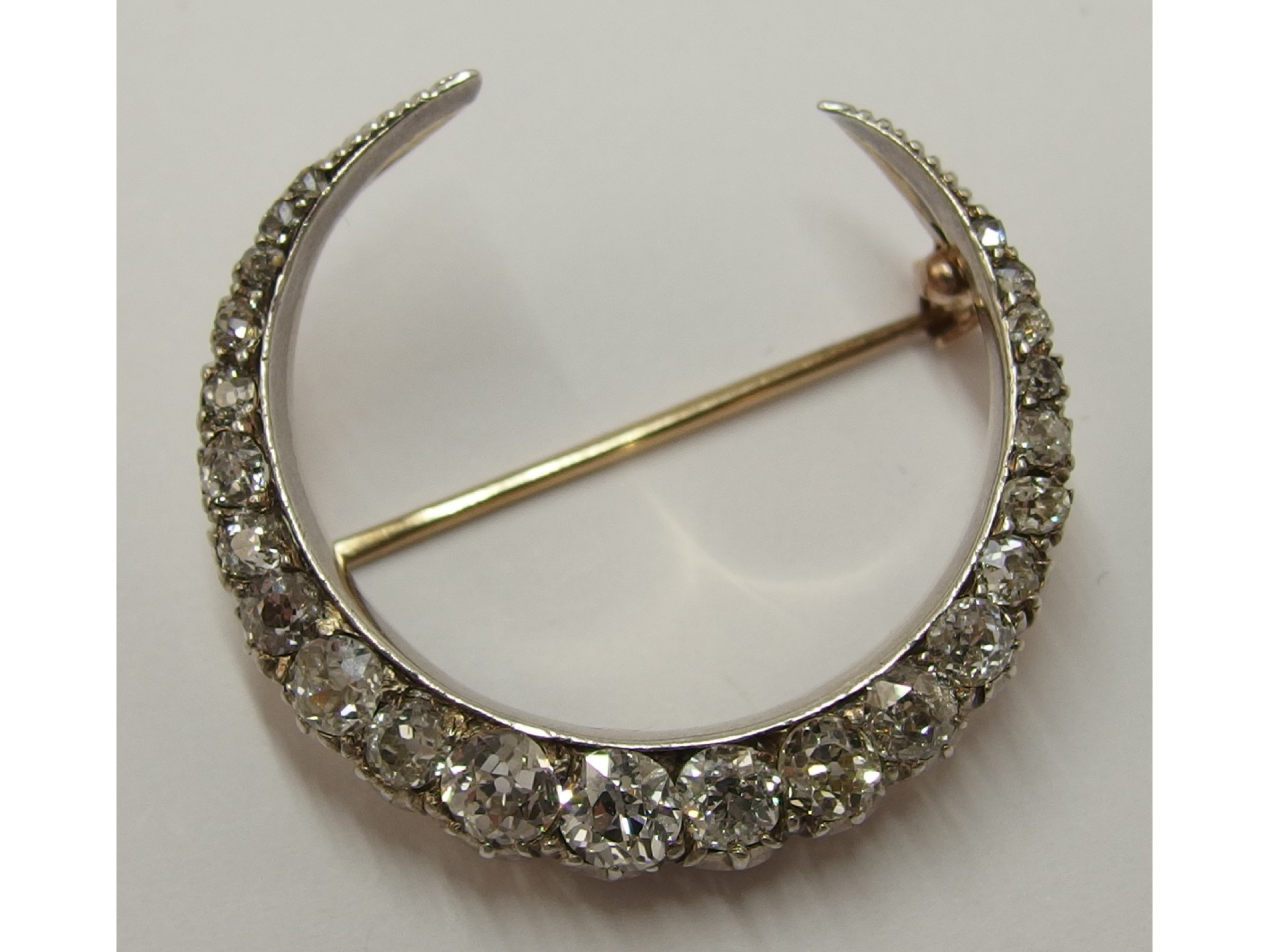 Appraisal: A Victorian diamond crescent moon broochset with approximately cts of