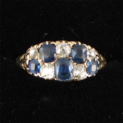 Appraisal: A sapphire and diamond 'checkerboard' ring set with five cushion