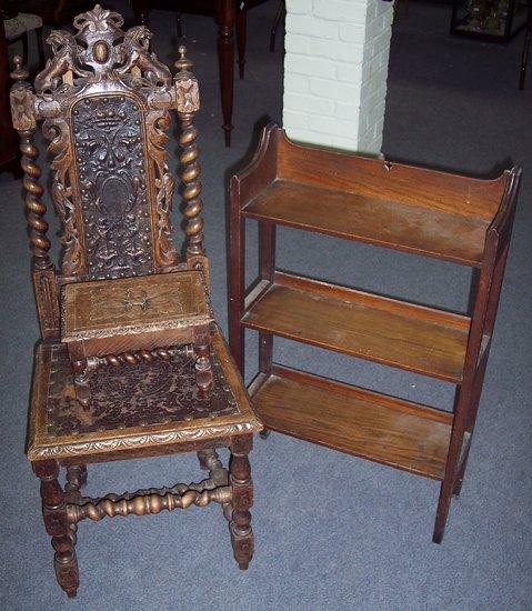 Appraisal: A carved oak hall chair with embossed leather panel back