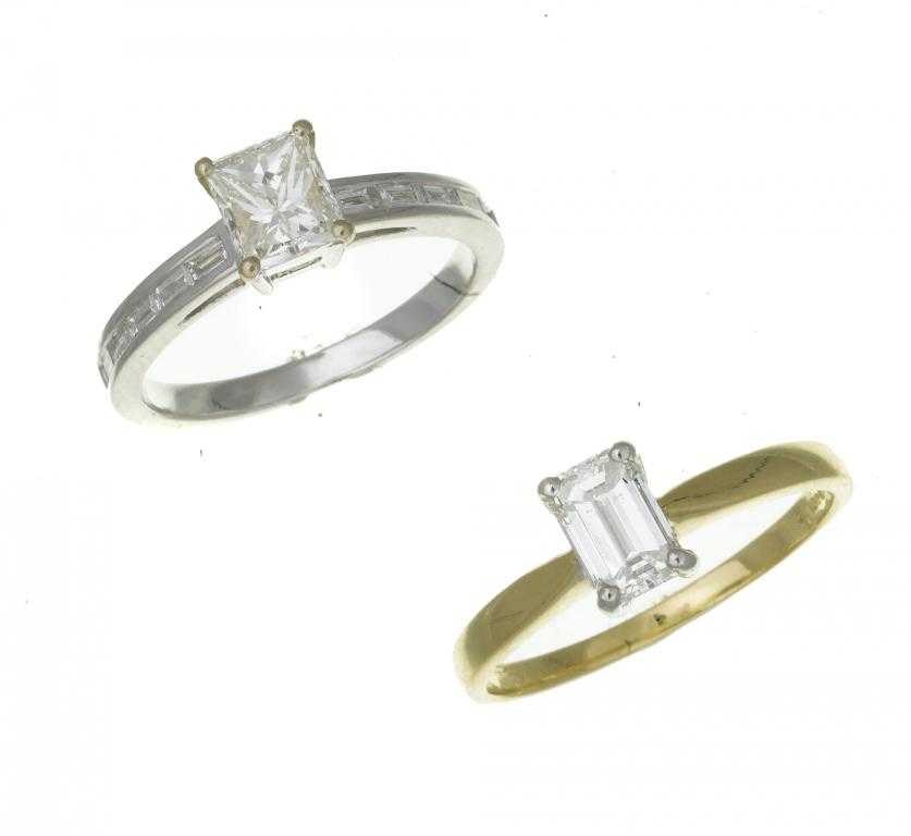 Appraisal: TWO DIAMOND RINGS one a solitaire with emerald cut diamond