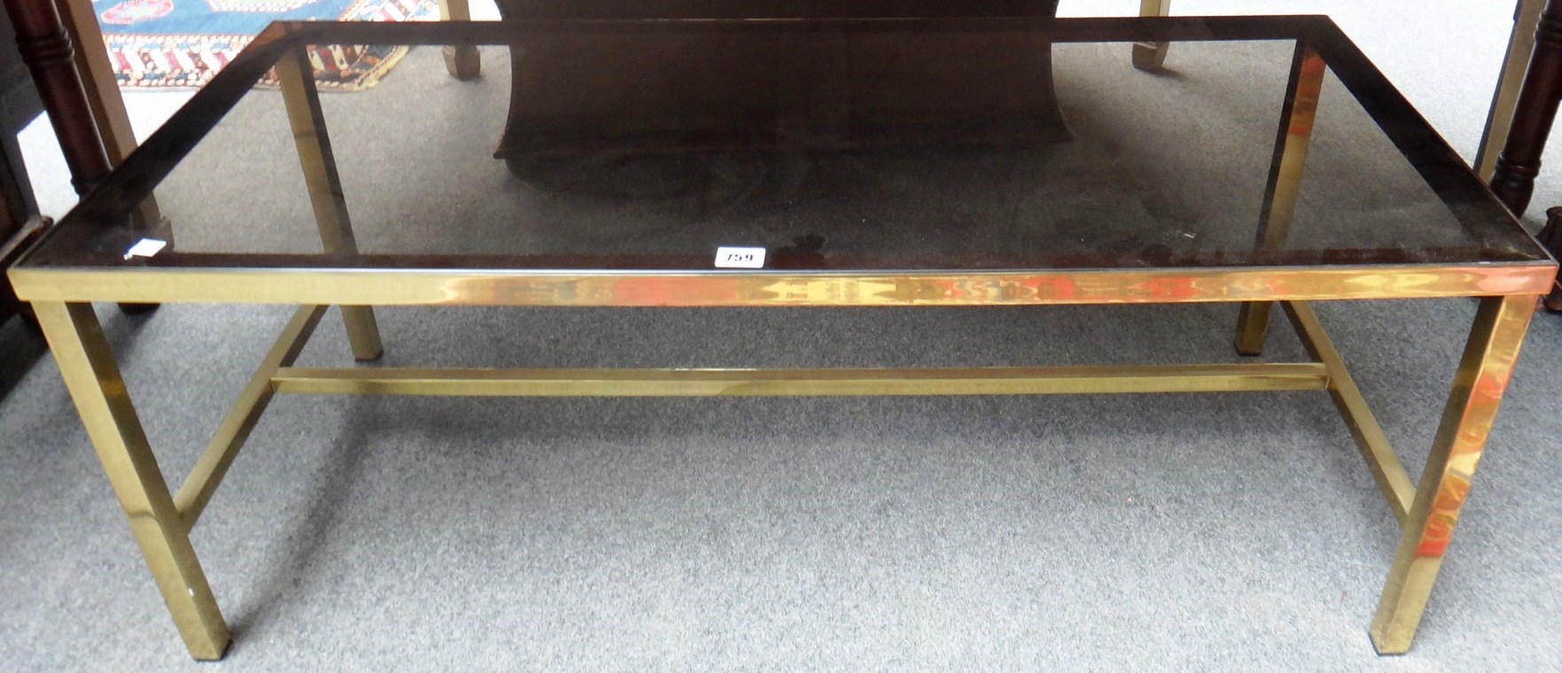 Appraisal: A th century lacquered brass rectangular coffee table on square