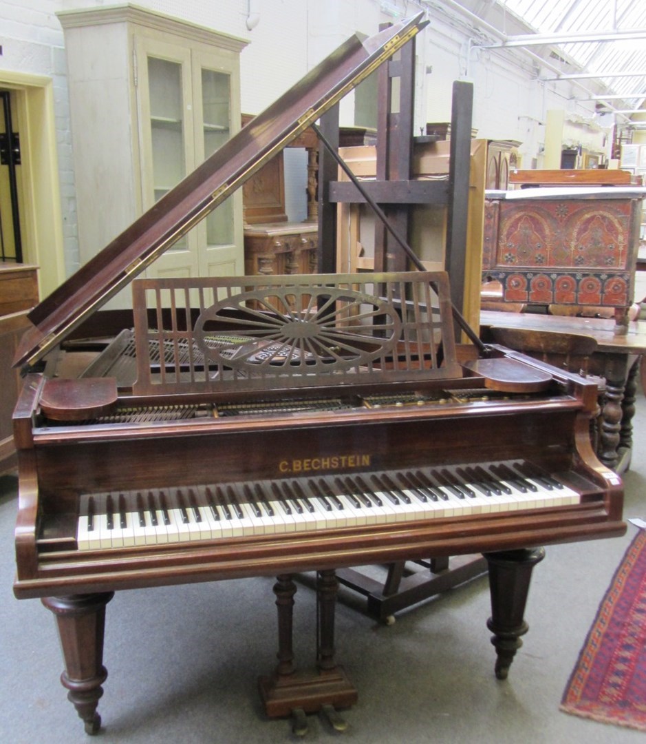 Appraisal: A Bechstein faded rosewood cased over strung iron framed grand