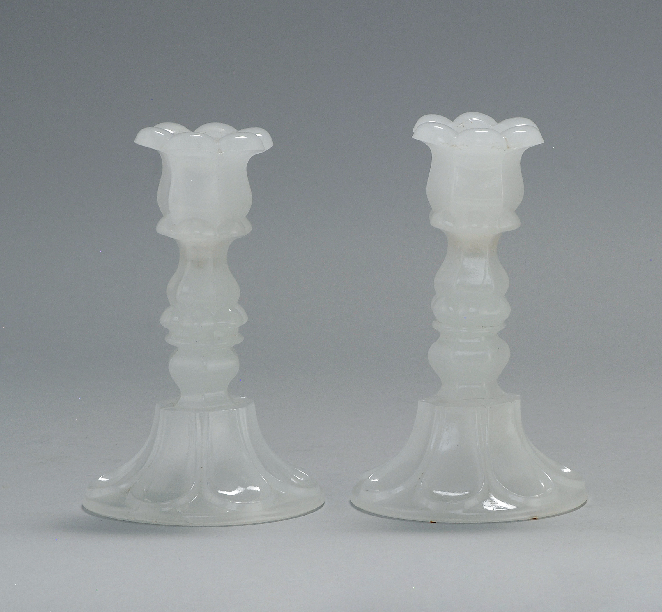 Appraisal: PAIR OF SANDWICH GLASS CANDLESTICKS Mid- th CenturyIn clambroth in