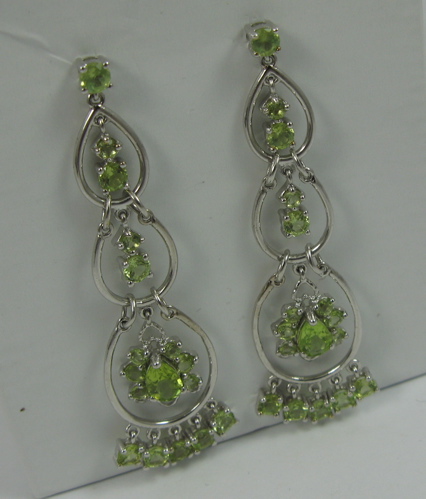 Appraisal: PAIR OF HIDDENITE AND K WHITE GOLD EARRINGS with oval-cut