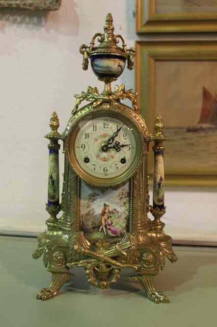 Appraisal: A SIMILAR REPRODUCTION FRENCH GARNITURE DE CHEMINEE with central clock