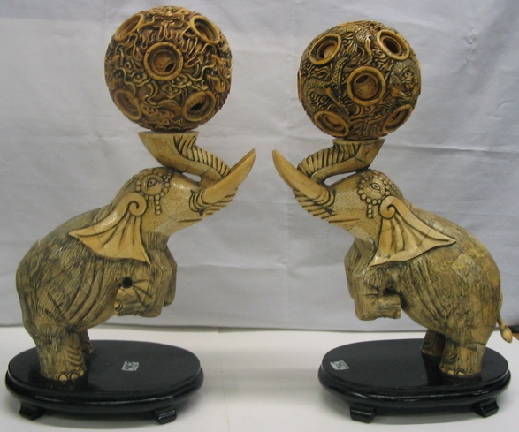 Appraisal: PAIR OF CHINESE BOND FIGURAL ELEPHANTS each raising mystery balls