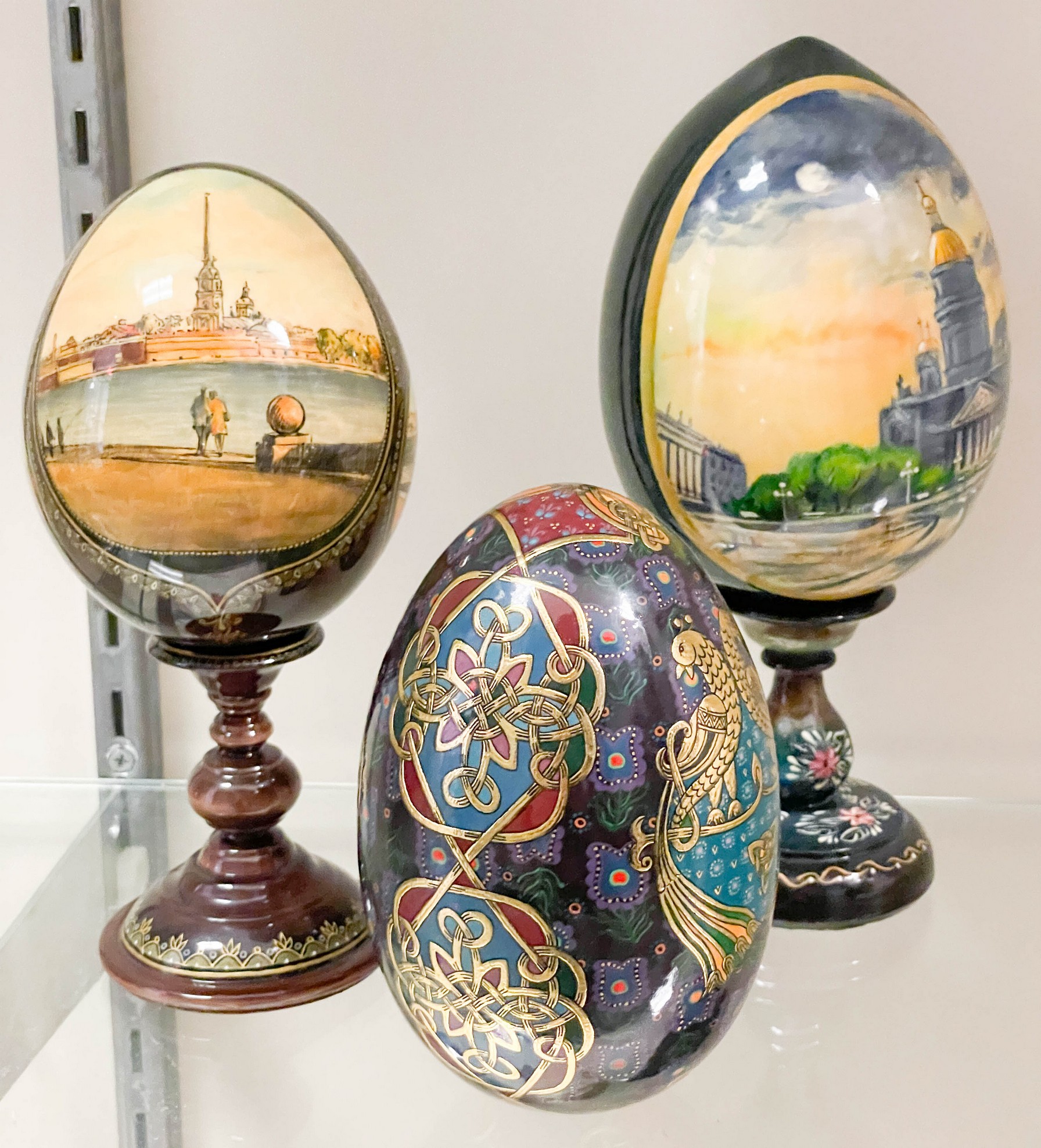 Appraisal: Decorative enamel eggs c o Russian eggs with painted wood