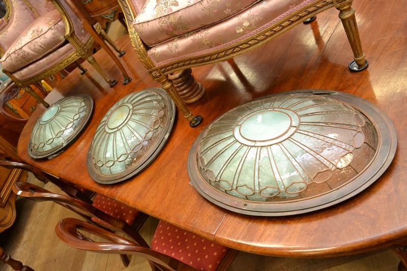 Appraisal: THREE COPPER AND GLASS OVAL SHAPED ART DECO WINDOWS FROM