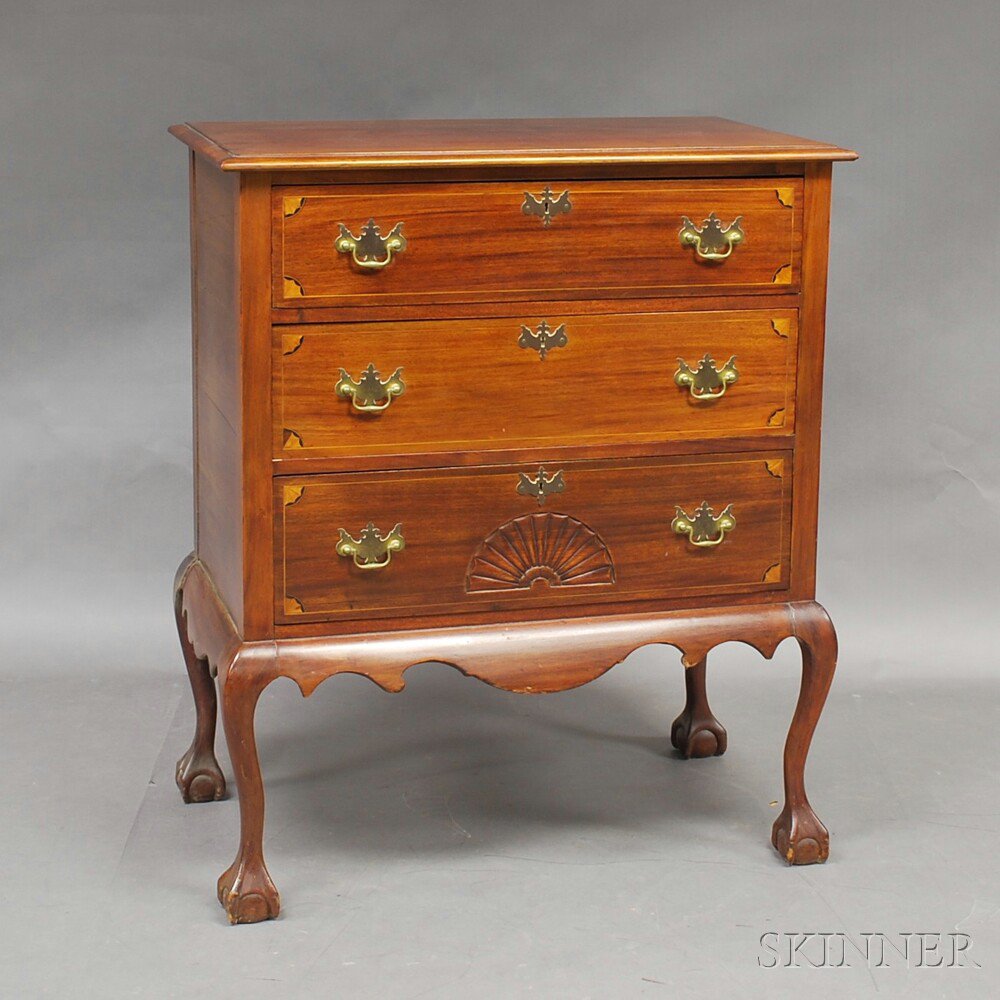 Appraisal: Queen Anne-style Carved and Inlaid Mahogany Three-drawer Chest on Frame