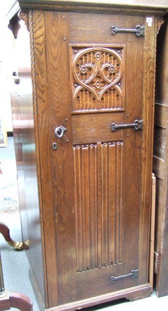 Appraisal: A mid th century oak hall cupboard the single door