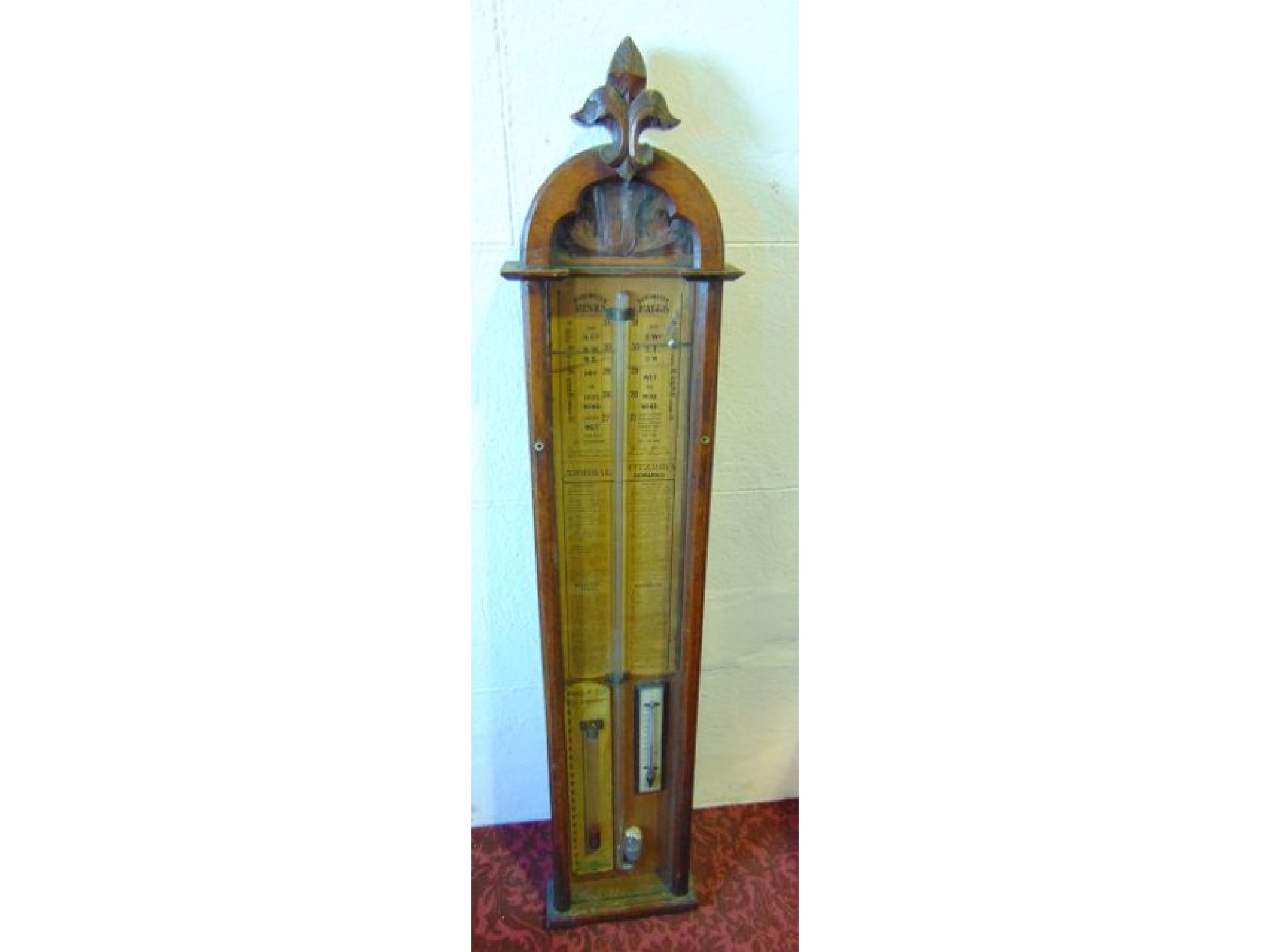 Appraisal: A Victorian Admiral Fitzroy's barometer in a carved gothic oak