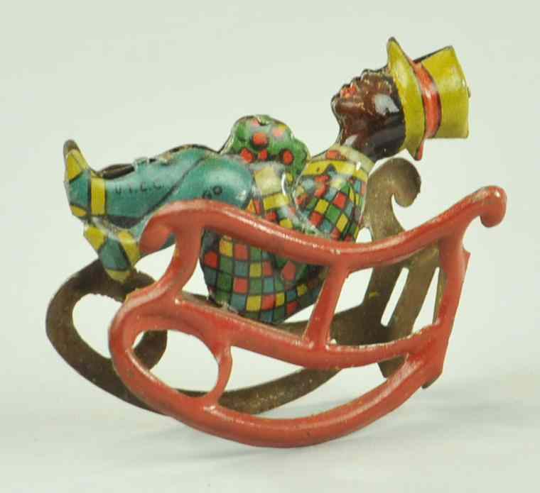 Appraisal: MAN IN ROCKING CHAIR PENNY TOY Germany lithographed tin depicted