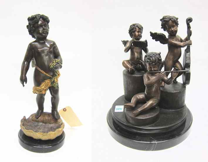 Appraisal: TWO BRONZE CUPID SCULPTURES ''H cupid figural musicians group and