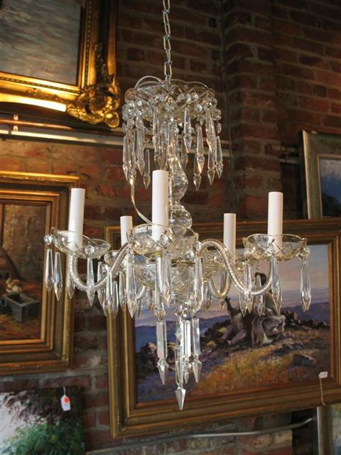 Appraisal: FIVE LIGHT CRYSTAL CHANDELIER With scalloped drip pans suspending spear