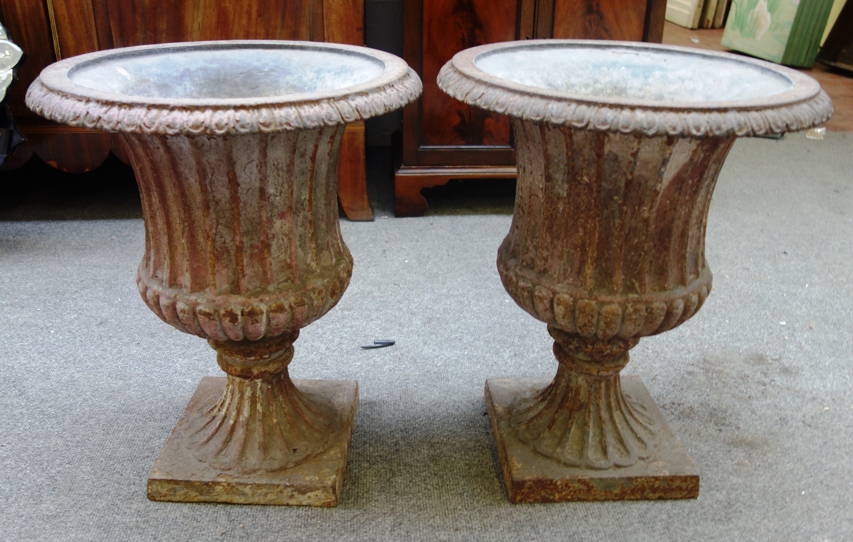 Appraisal: A pair of lead lined cast iron jardinieres with fully