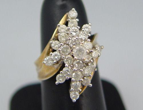 Appraisal: K DIAMOND PRINCESS RING K yellow gold cluster ring contains