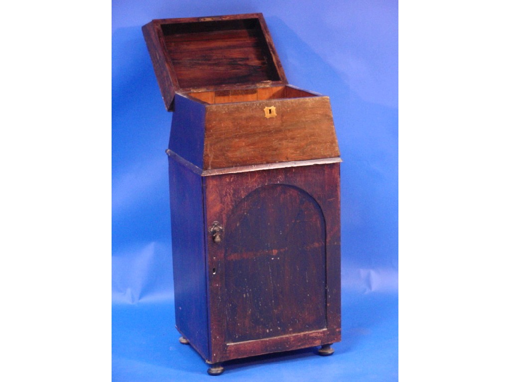 Appraisal: A Victorian rosewood sarcophagus top cupboard with single door cm