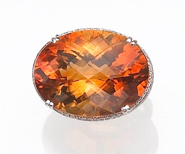 Appraisal: Property of various owners centering an oval-shaped mixed-cut citrine the