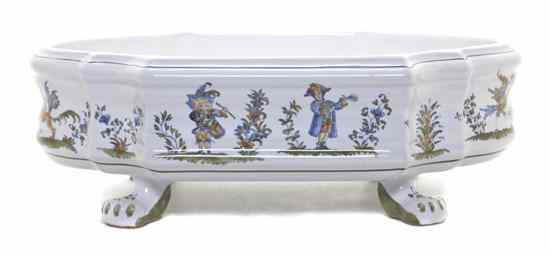 Appraisal: A French Faience Jardiniere of cartouche form the sides decorated