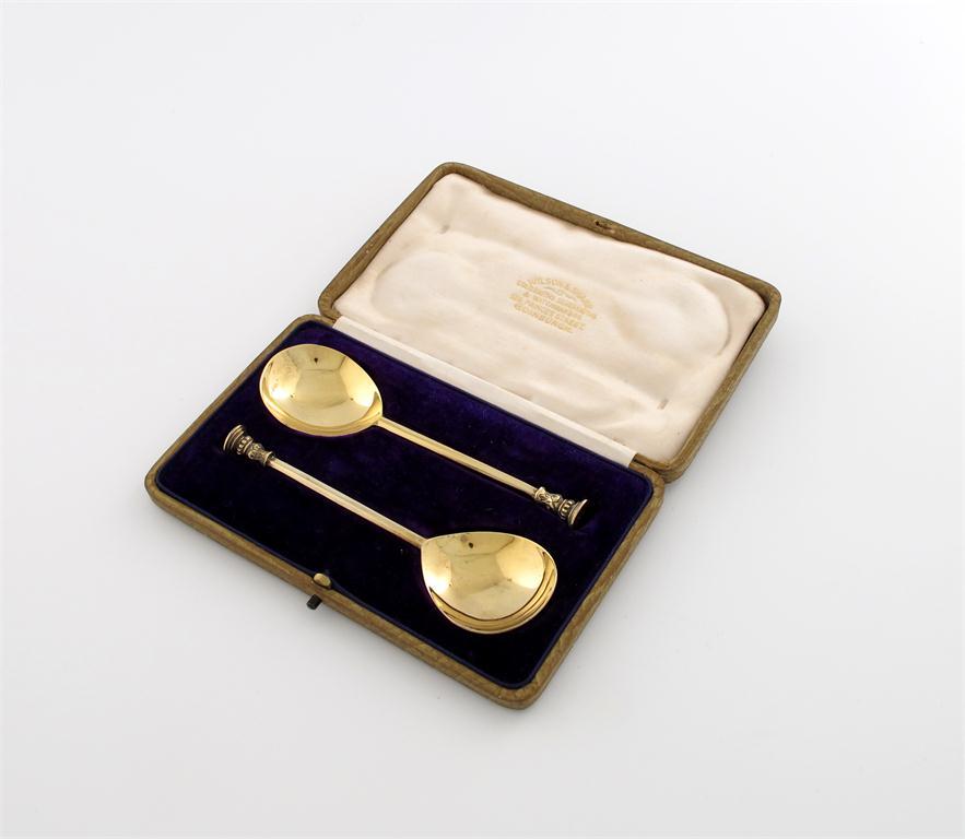 Appraisal: A pair of silver-gilt seal-top spoons