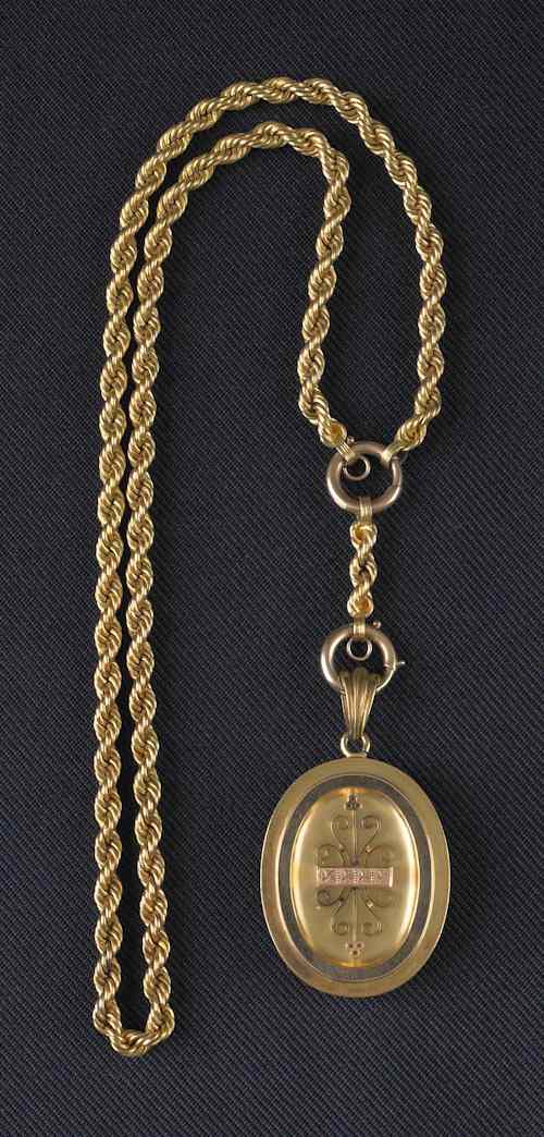 Appraisal: K yellow gold Victorian pendant with reverse photo and a