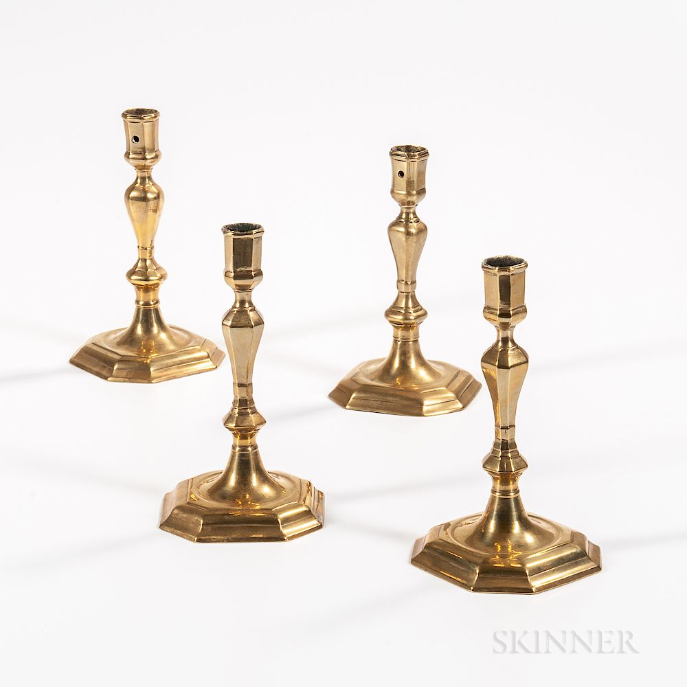 Appraisal: Four Brass Candlesticks Four Brass Candlesticks England and Europe early