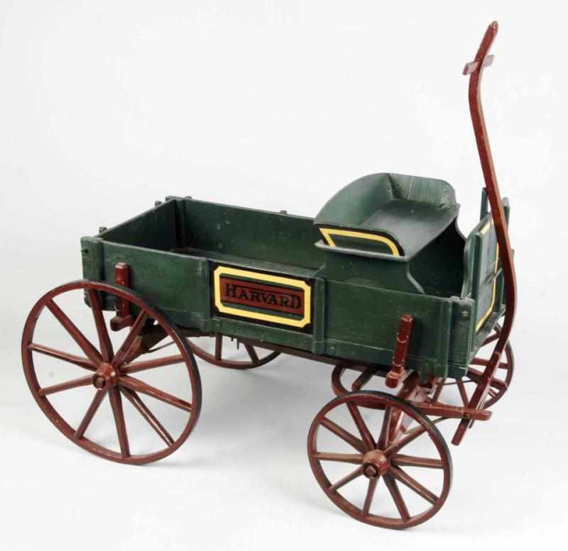 Appraisal: Wooden Harvard Wagon Description Wagon has been repainted and refinished