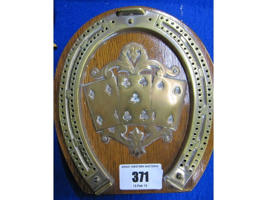 Appraisal: Oak and brass mounted horseshoe cribbage board