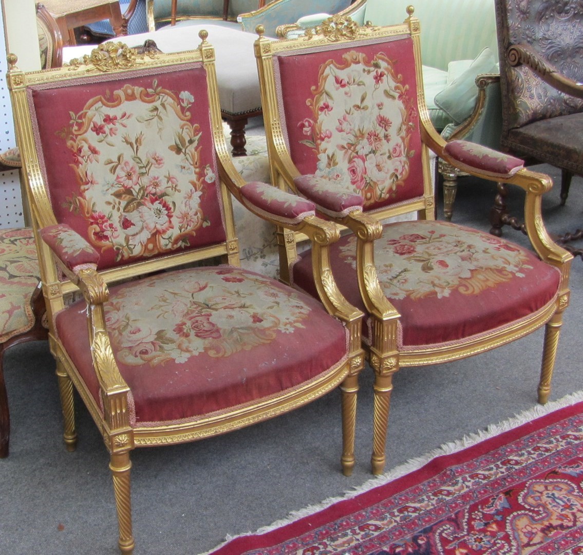 Appraisal: A pair of late th century gilt framed fauteuils with