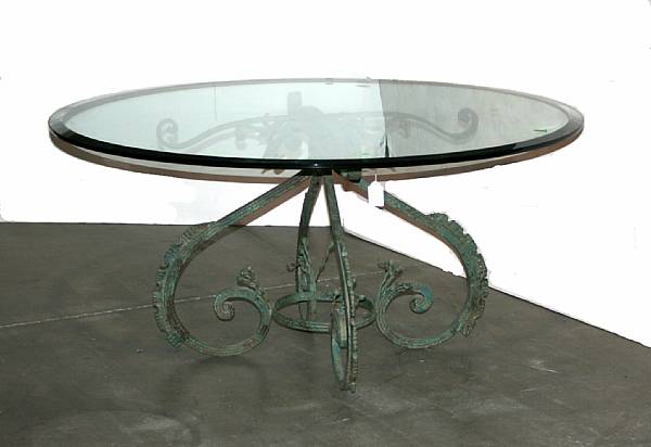 Appraisal: A Neoclassical style patinated iron and glass dining table th