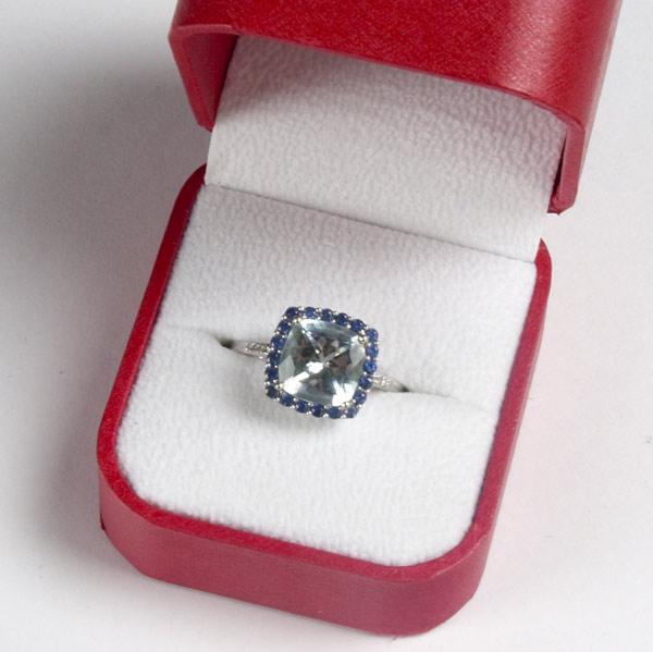 Appraisal: AQUAMARINE AND SAPPHIRE RING K wg square-set cluster aquamarine cts