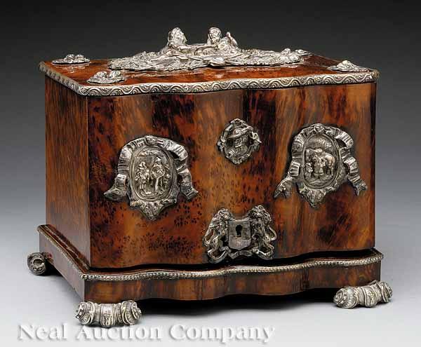 Appraisal: A Continental Mulberry Wood Humidor with Silvered Metal Figural Mounts