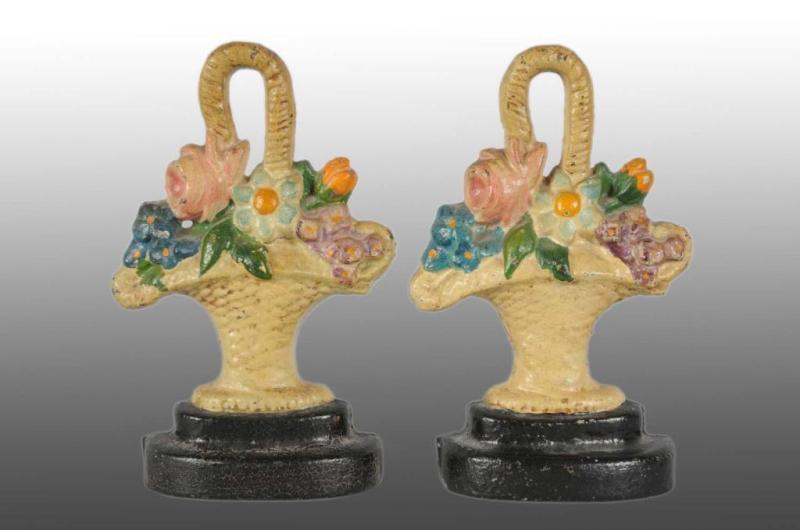 Appraisal: Lot of Cast Iron Flowers in Basket Doorstops Description Made