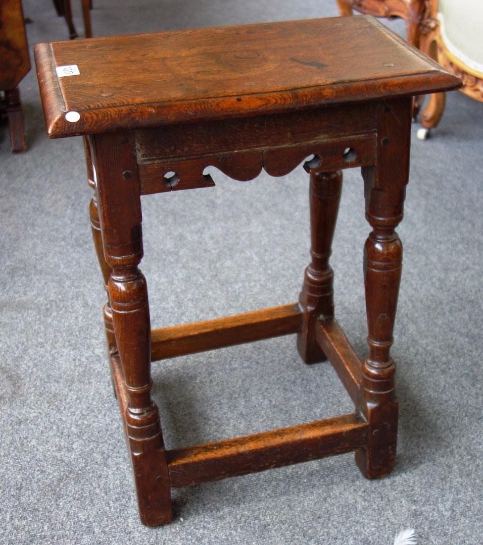 Appraisal: A th century style oak joint stool with shaped frieze