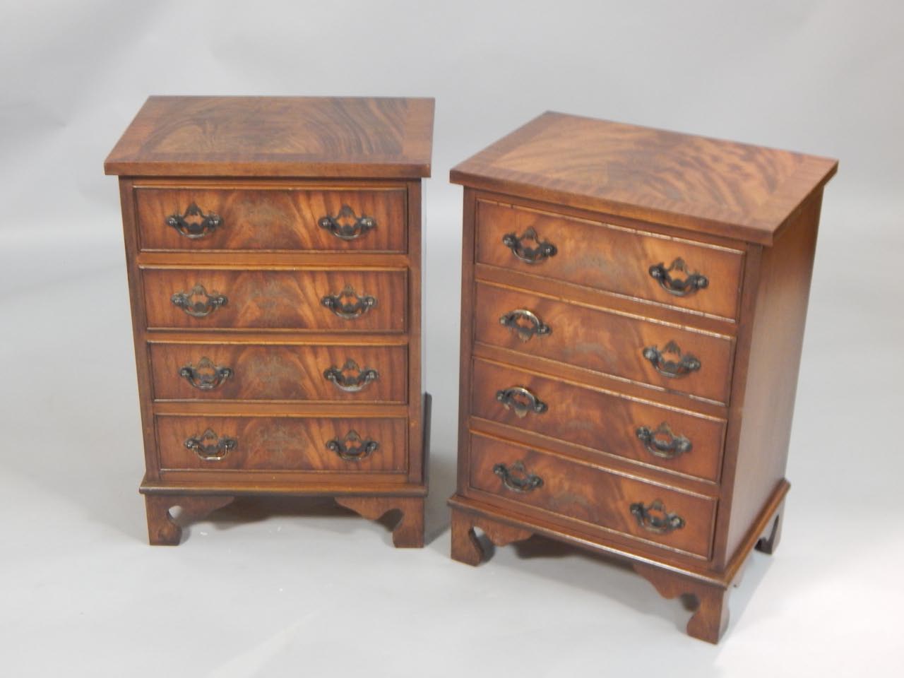 Appraisal: A pair of reproduction mahogany bedside chests each with a