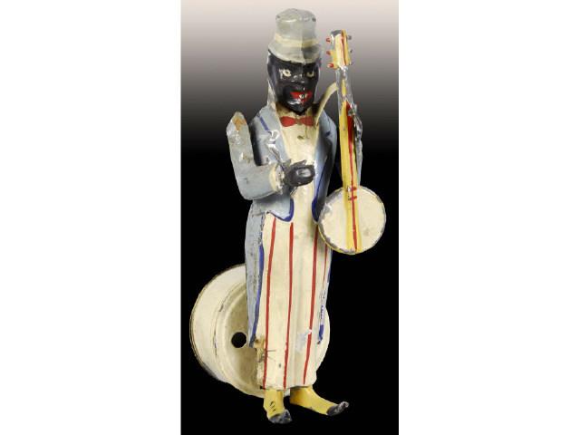 Appraisal: Tin German Windup Black Man Playing Banjo Toy Description Hand