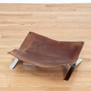 Appraisal: Ross Littell style steel and leather footstool Ross Littell style