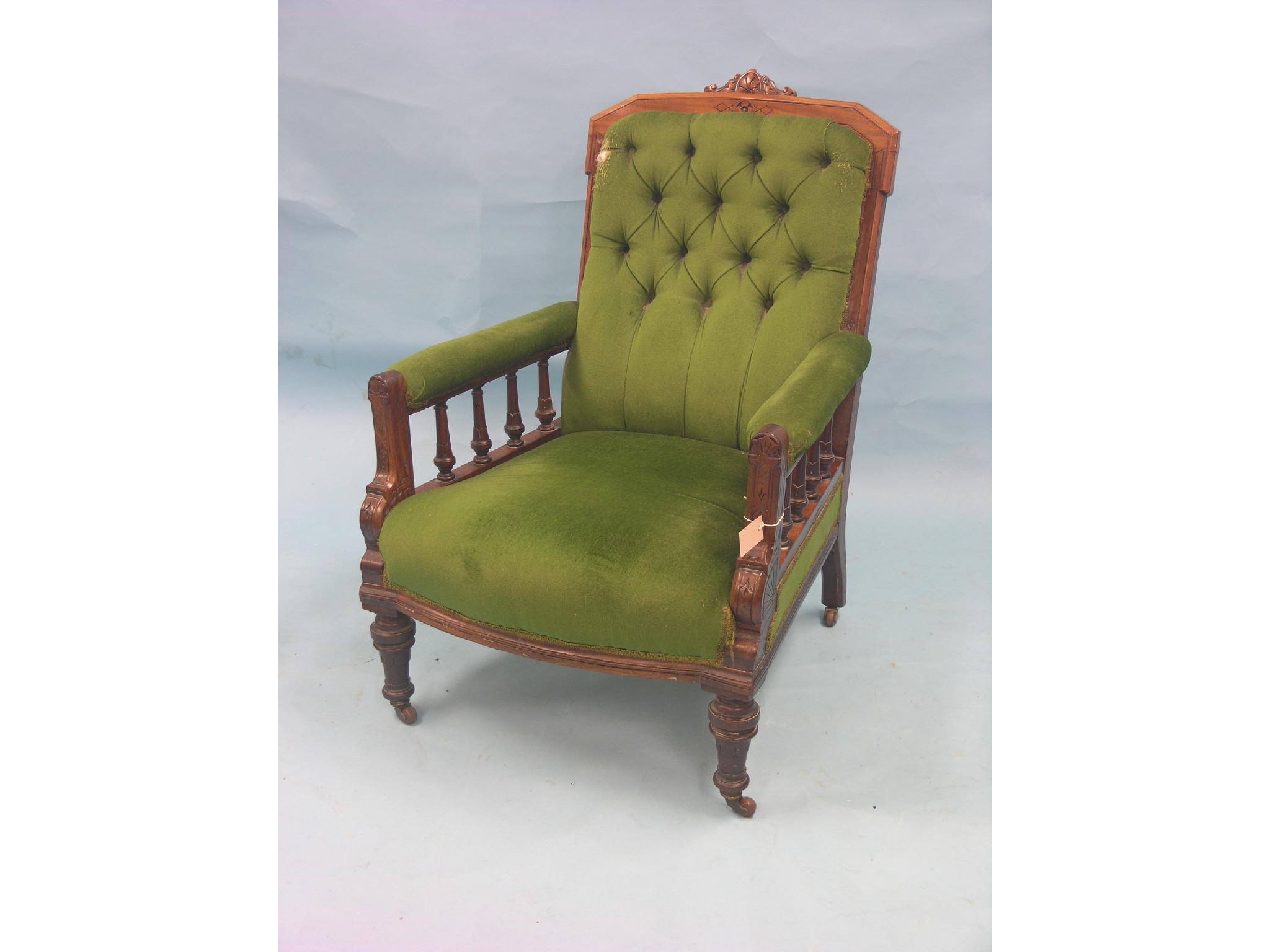 Appraisal: A Victorian red walnut Grandfather armchair with carved cresting and