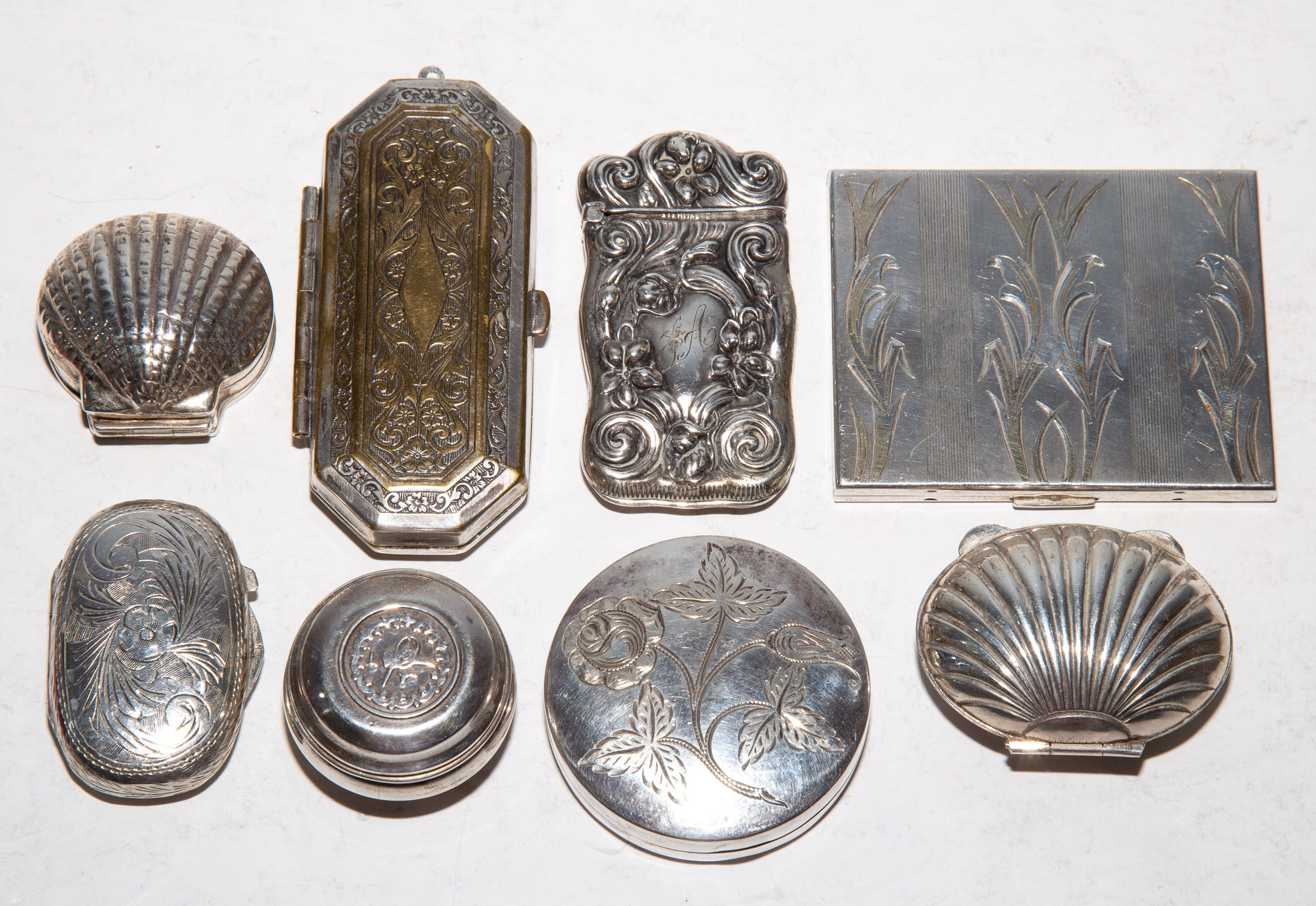 Appraisal: EIGHT SILVER OBJETS DE VERTU Including a sterling compact match